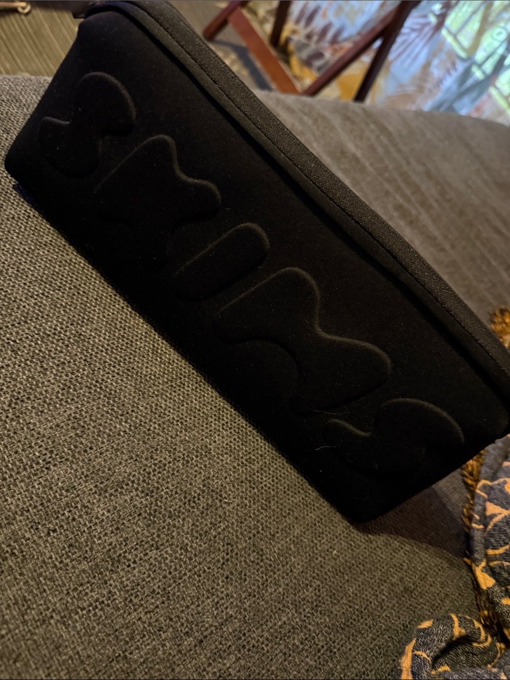 SKIMS Black Quilted makeup bag.
